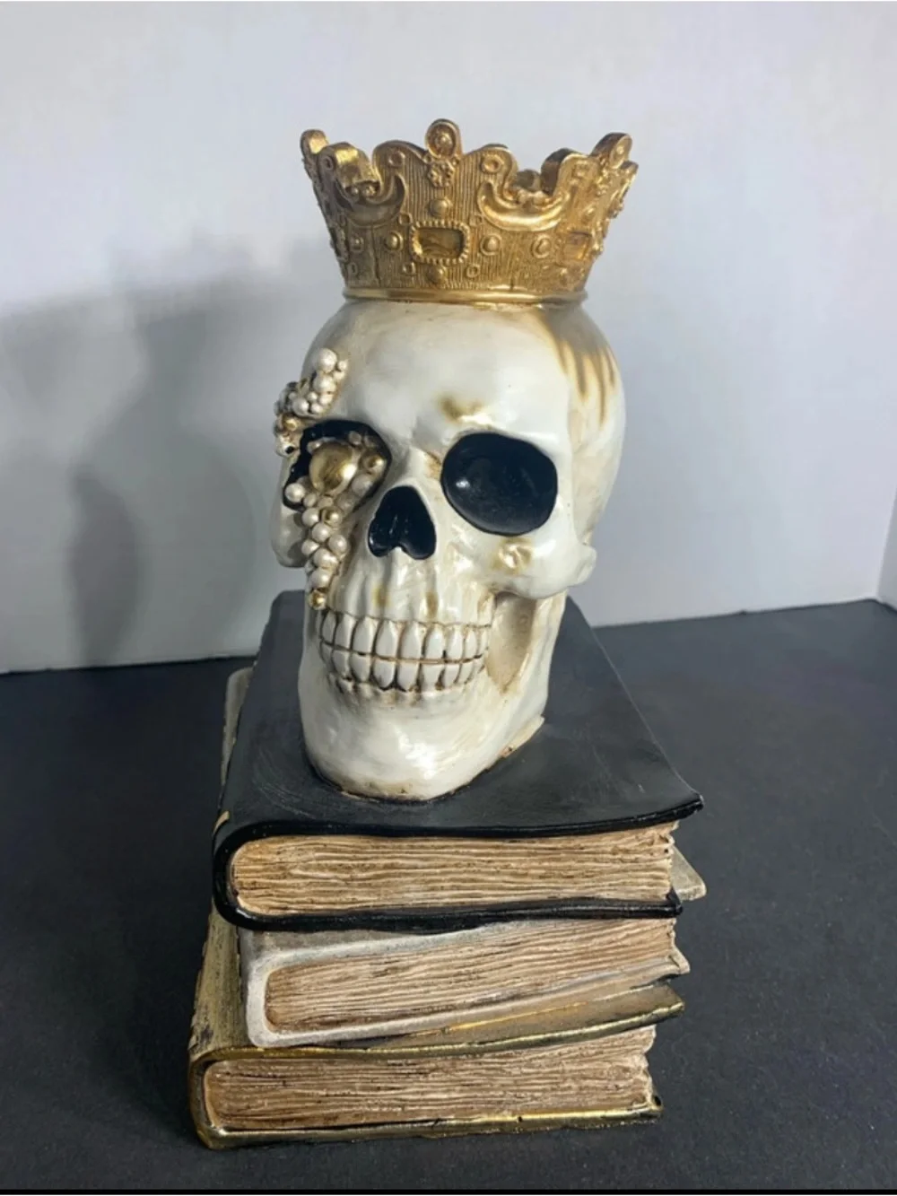 Decorative White and Gold Skull on Stacked Spell Books - Home Accent